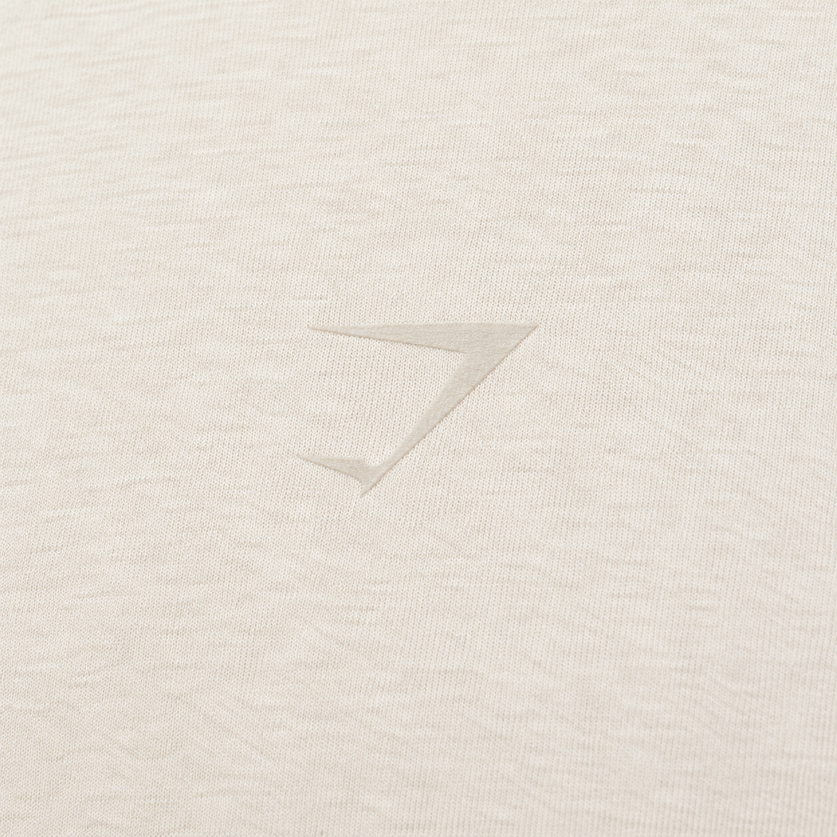 Gymshark Power T-Shirt Bros Chalk Marl, detalle de logo y material — Crazy!Duck Hype