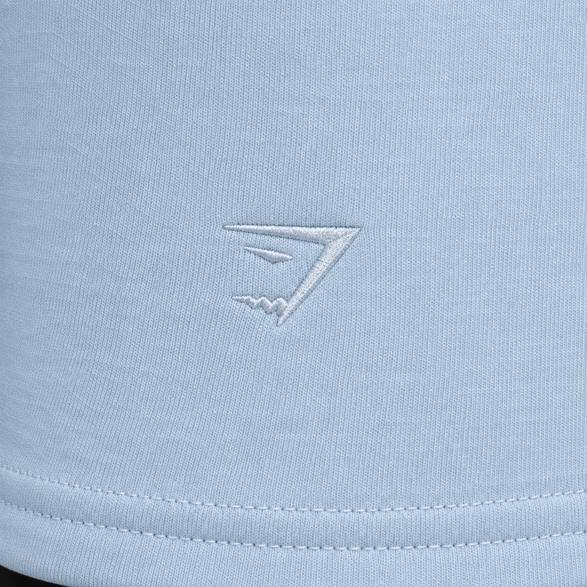 Gymshark Script Embroidery Joggers Chilled Blue, detalle de logo y material — Crazy!Duck Hype