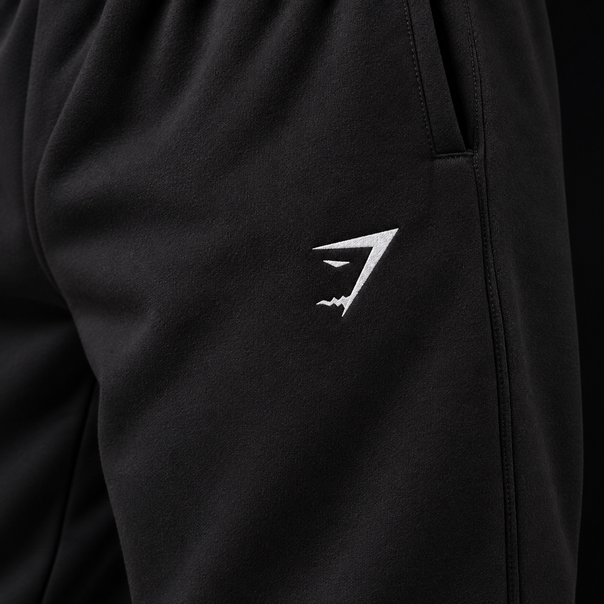 Gymshark Essential Oversized Joggers Black, detalle de logo y material — Crazy!Duck Hype