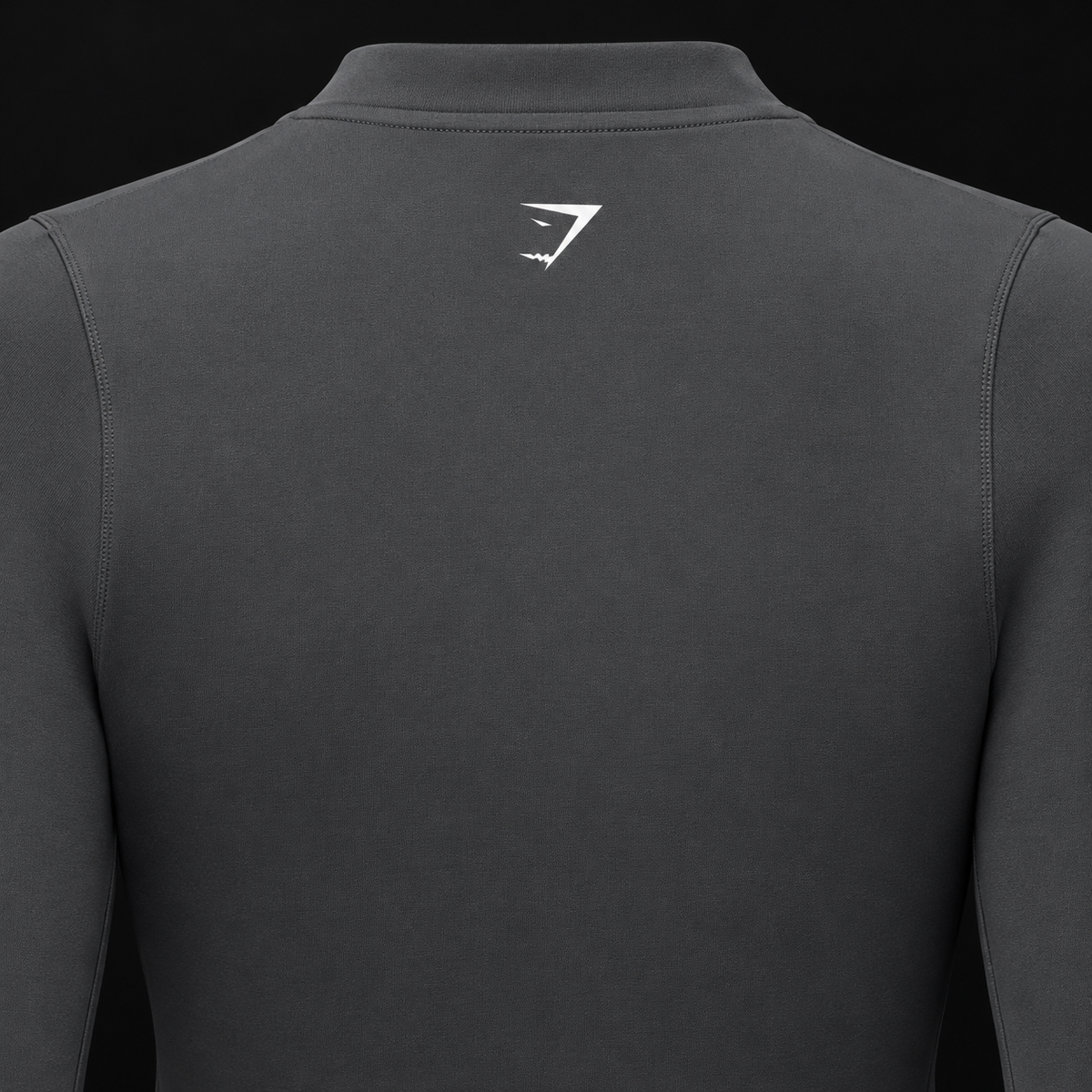 Gymshark Everyday Seamless Zip Tracktop Onyx Grey, detalle de logo y material — Crazy!Duck Hype