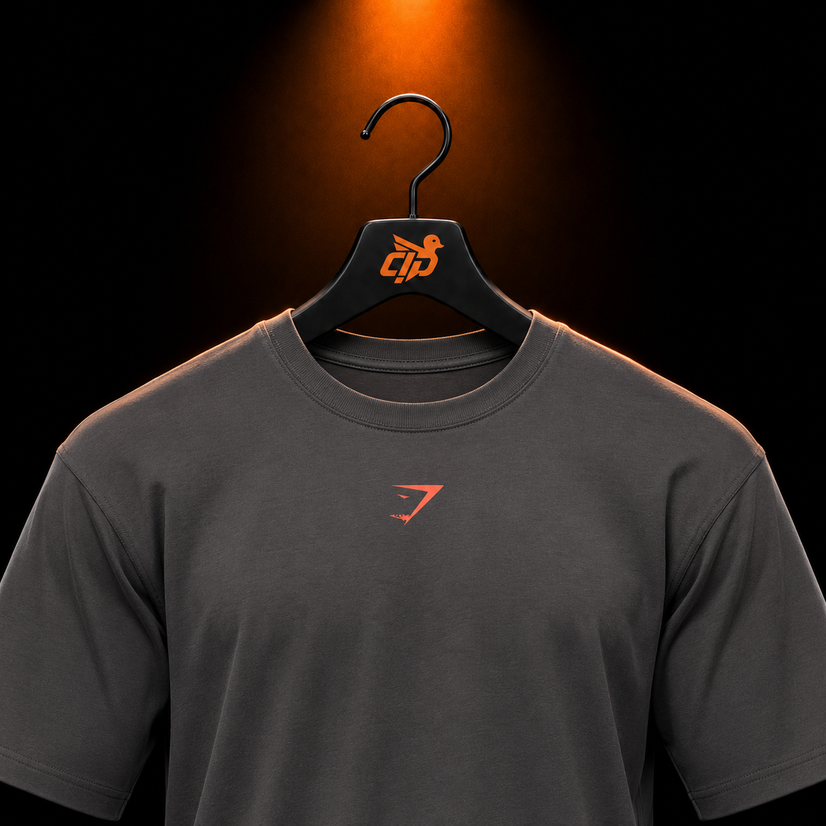 Gymshark Power T-Shirt Onyx Grey/Bold Orange con presentación de producto — Crazy!Duck Hype