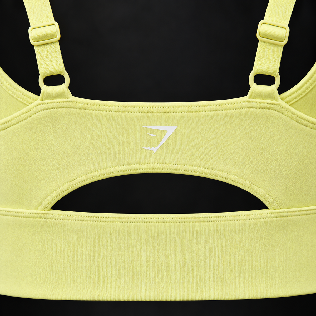 Gymshark Twist Front Sports Bra Sorbet Yellow, detalle de logo y material — Crazy!Duck Hype