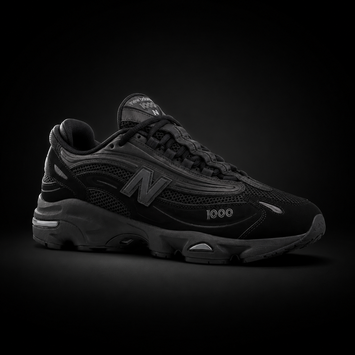 New Balance 1000 Triple Black, vista frontal — Crazy!Duck Hype