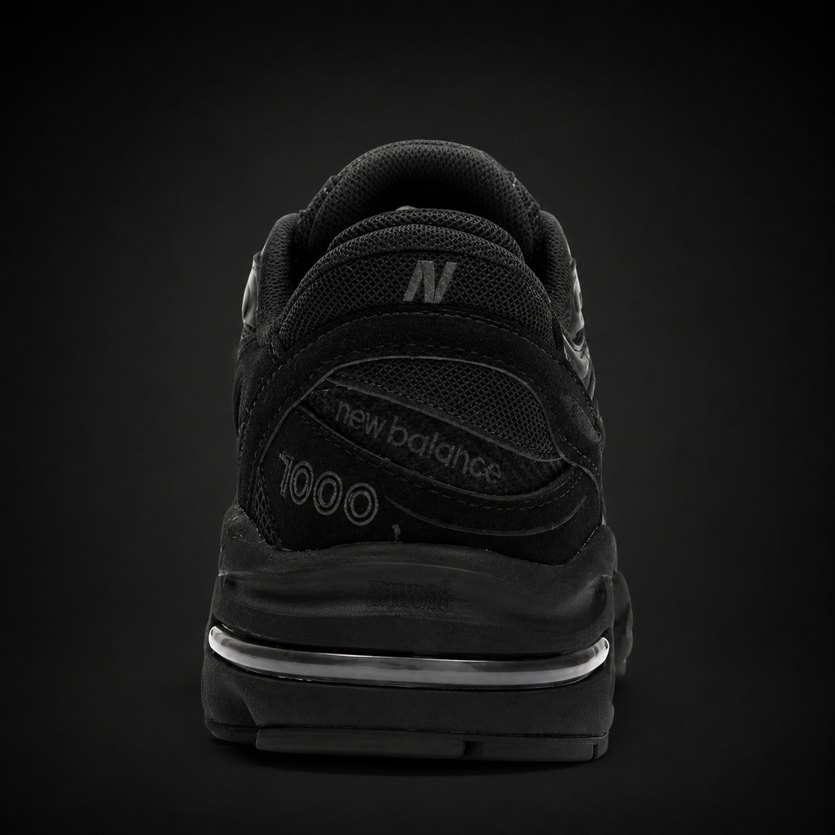 New Balance 1000 Triple Black, vista trasera — Crazy!Duck Hype